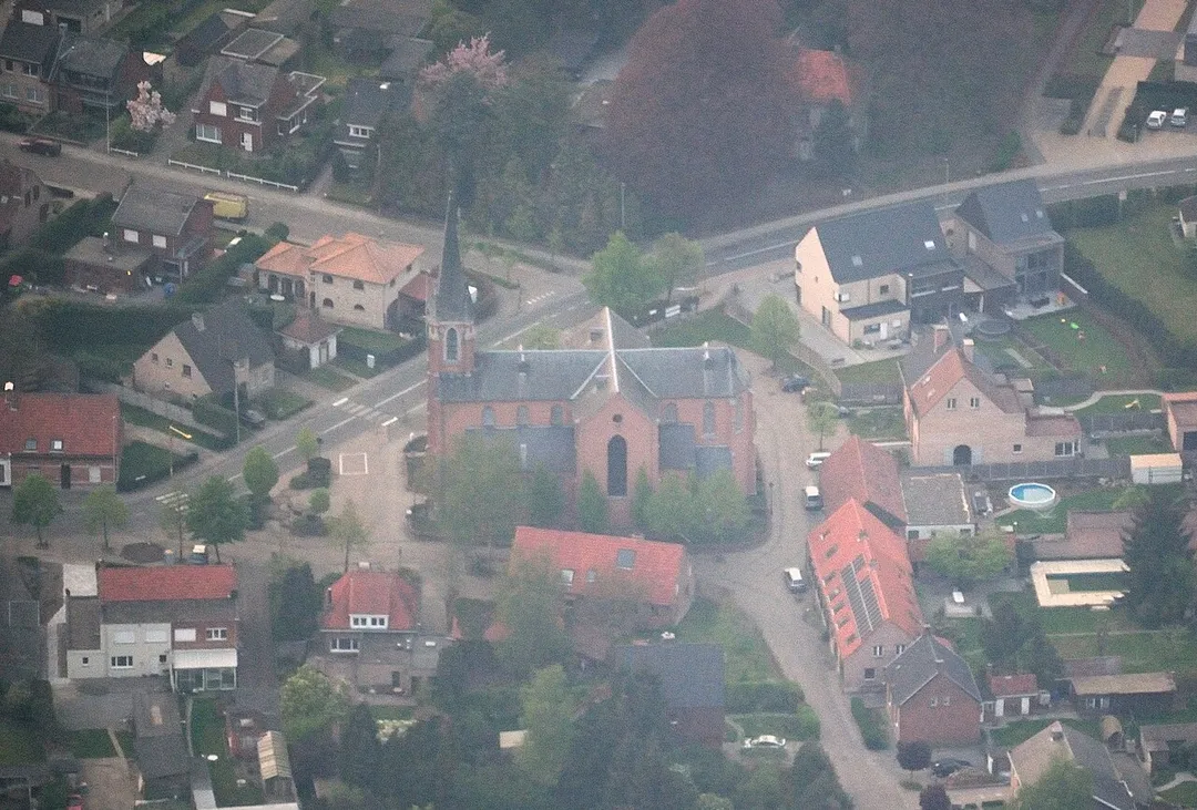 Aerial view of the village centre of Emblem, commune of Ranst, Belgium, with Saint Gummarus' church from the South side. Nikon D60 f=160mm f/5.3 at 1/250s ISO 800. Processed using Nikon ViewNX 1.5.2 and GIMP 2.6.6.