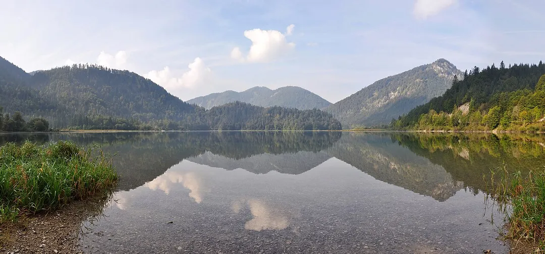 Weitsee (seen from the eastern bank) is a small lake on between Reit im Winkl and Ruhpolding with an area of 63.60 ha and a maximum depth of 9.30 m. The lake itself is separated in a shallow western and a deeper eastern part by a mountain halfisland. It is the first lake in the Dreiseengebiet (Three Lake Area) followed by the Mittersee and Lödensee.