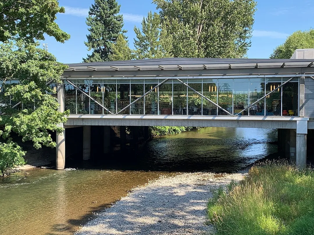 The Renton Public Library spans the Cedar River in Renton, WA. Originally constructed in 1966, it was completely rebuilt in 2014-2015 to modern standards.