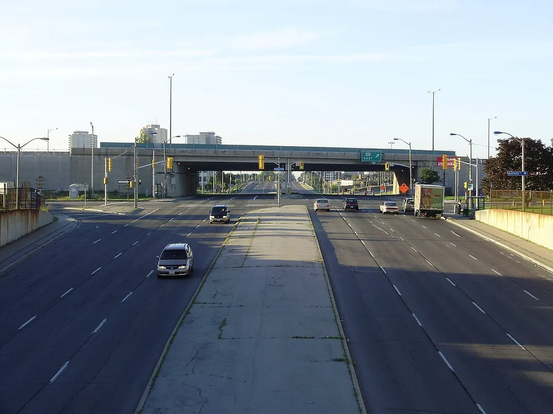 A view of Kipling Avenue, looking south past its intersection with Belfield Road toward the elevated bridge carrying Highway 409. Photograph taken from the Etobicoke North GO Station footbridge in Toronto, Ontario, Canada.