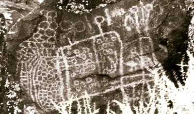 Coso petroglyphs rock art in the Archaic abstract curvilinear style — at the Coso Rock Art District National Historic Landmark, in the Mojave Desert and Inyo County, California.
More than 250,000 pre-Columbian rock art petroglyphs are located on 36,000 acres of the Coso Range, within the Naval Air Weapons Station China Lake.