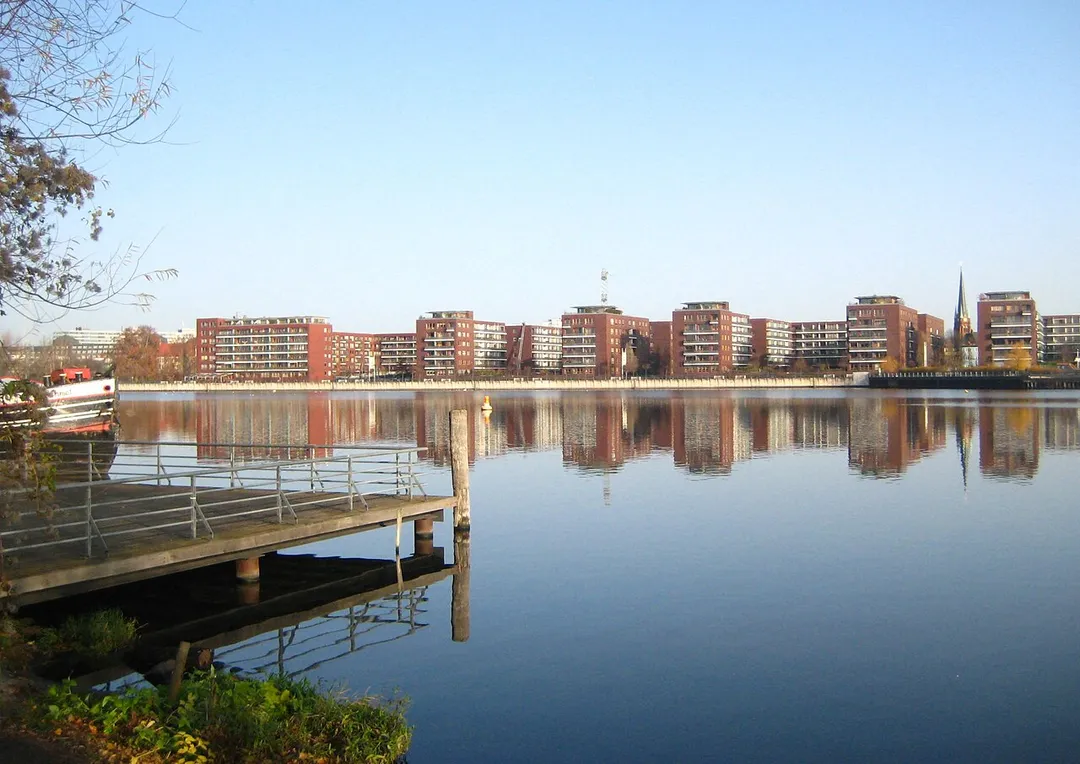 A view over the Rummelsburg Lake in Berlin from the Stralau peninsula in the borough of Friedrichshain to the residential complex Hauptstraße in the borough of Rummelsburg. The buildings were construct in 1997/1998. On the right side, behind the appartments, the Church Of Our Savior.