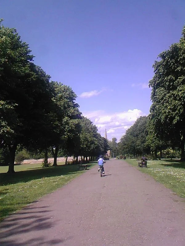 Hall Park with the spire of St Mary's Church in the far distance, Rushenden, Northants.