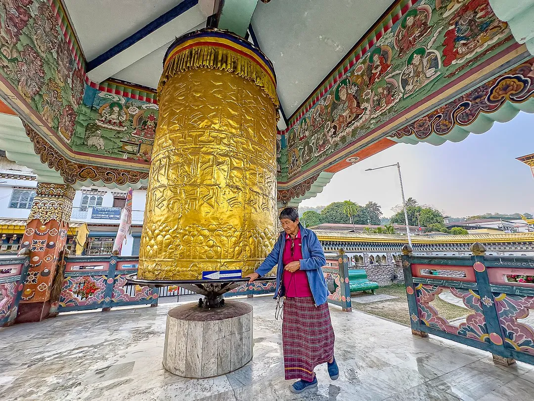 A prayer wheel, or Mani wheel, is a cylindrical wheel (Tibetan: འཁོར་ལོ།, Wylie: 'khor lo, Oirat: кюрдэ) for Buddhist recitation. The wheel is installed on a spindle made from metal, wood, stone, leather, or coarse cotton. Prayer wheels are common in Tibet and areas where Tibetan culture is predominant.
Traditionally, a mantra is written in Ranjana script or Tibetan script, on the outside of the wheel. The mantra Om mani padme hum is most commonly used, but other mantras can also be used.
Prayer wheels sometimes depict dakinis and the eight auspicious symbols (ashtamangala). At the core of the cylinder, as the axle of the wheel, is a "life tree" made of wood or metal with mantras written on or wrapped around it.

According to the Tibetan Buddhist tradition, spinning such a wheel will have much the same meritorious effect as orally reciting the prayers.