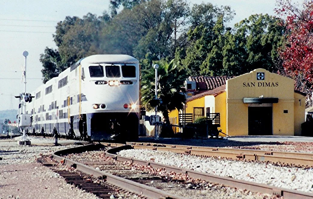 Southern California MetroLink commuter running off route, pulling a Rose Parade Special eastbound through San Dimas. This photograph was published in the April 1998 issue of Trains Magazine.