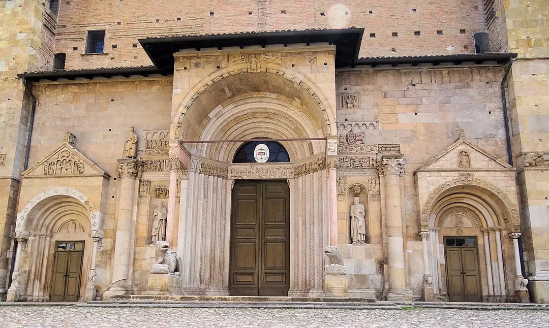 The lower part of the west-facing facade of the cathedral in Fidenza, a fine example of Romanesque architecture.
