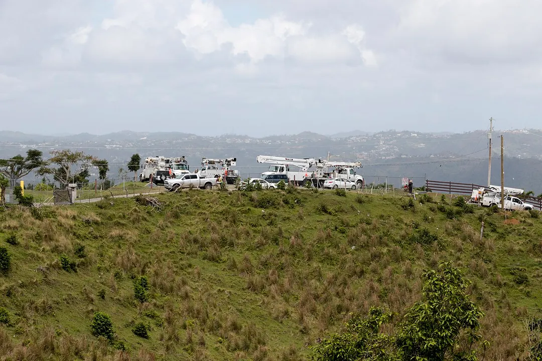 U.S. Army Corps of Engineers contractors, supporting the Montaña Area Office in Caguas, Puerto Rico, work in the municipality of San Lorenzo April 19. The distribution line they are working serves 437 residents. The mountainous region was one of the hardest hit when Hurricane Maria made landfall September 2017.