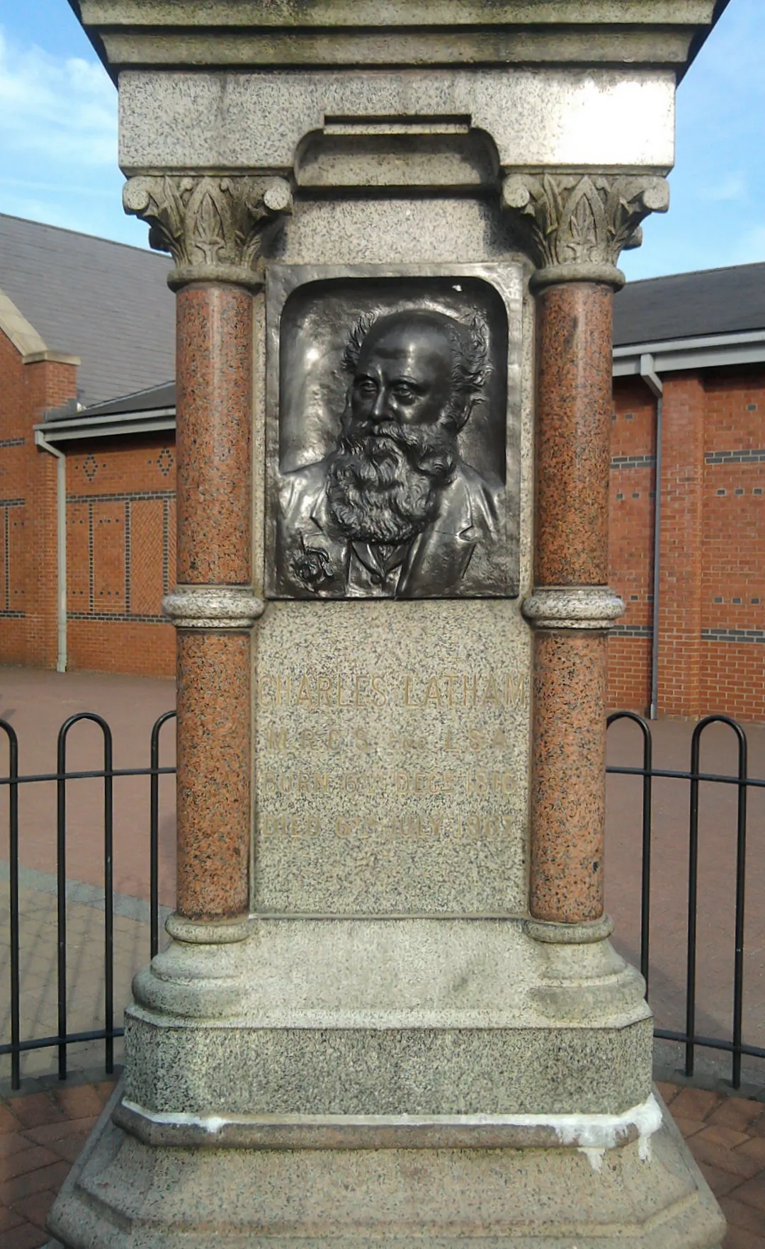 Charles Latham MRCS LSA (1816-1907) public memorial statue/monument in Sandbach, Cheshire, between Ashfields and Aldi. A "Surgeon General Practitioner" [1] (physician), he was born in Sandbach on 6 Dec 1816 (the son of Richard and Sarah Latham, [2]), he married Mary Newham, and died in Sandbach on 6 July 1907 aged 90. He held Membership of the Royal College of Surgeons, and was a Licenciate of the Society of Apothecaries.