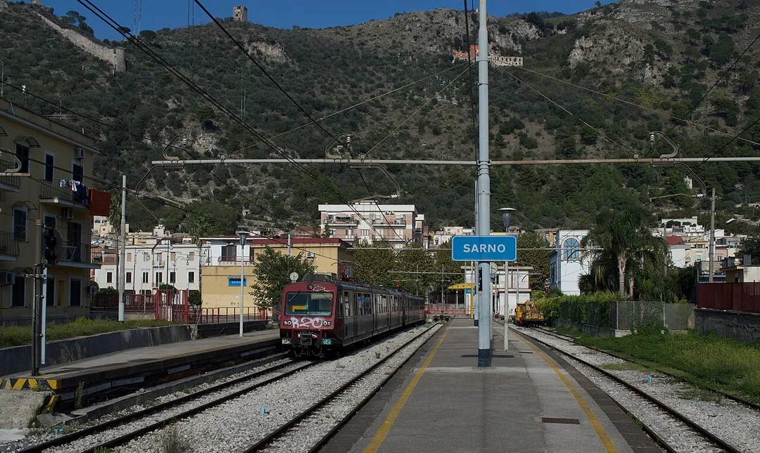 The 142km 950mm Circumvesuviana system from Napoli took two visits to cover and was successfully completed in October 2017. The final branch covered was from Sarno and covered just the one way as only a 15 minute walk from the Trenitalia mainline  station. With superb weather conditions and backdrop of the hills behind, a pair of ETR units numbers 027 and 054 form train 648, 15:49 Sarno to Napoli Porta Nolana. 
Circumvesuviana (CV) merged with other private operators in the Napoli area in 2013 to form Ente Autonomo Volturno (EAV).