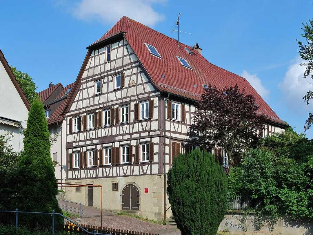 Old schoolhouse in Schwieberdingen in the federal state Baden-Württemberg in Germany. The original building from 1580 with one schoolroom and an apartment for the teacher was demolished and rebuilt in the years 1806/1807. The building serves since 1970 as a community apartment house.