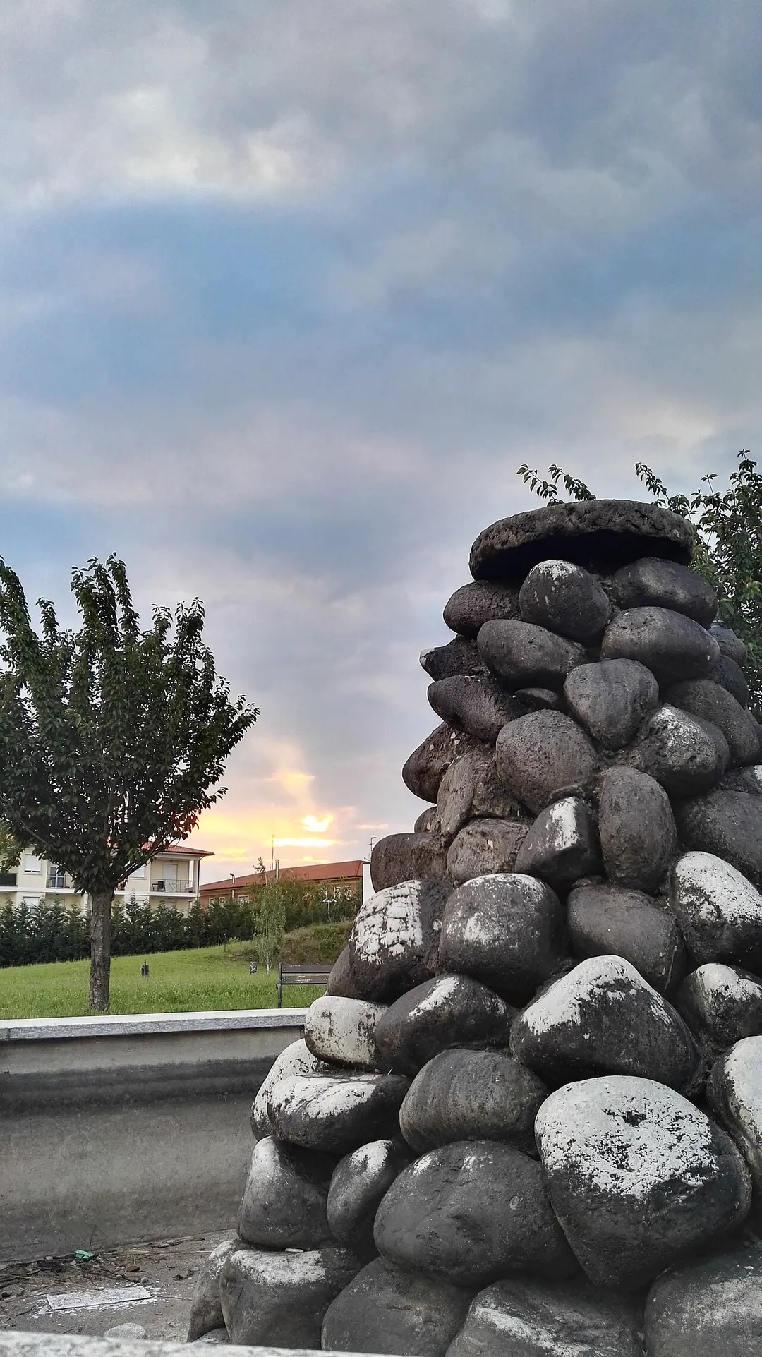 Picture of a rocky fountain taken at sunset taken in Sedriano, Milan, Italy