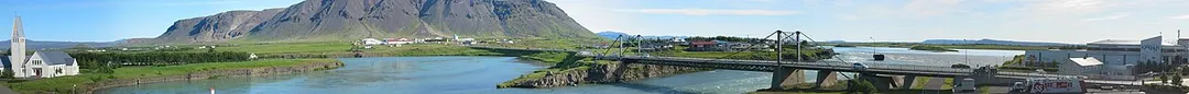 Panoramic image of the bridge over the Ölfusá in Selfoss. The picture was taken from a balcony of the Hotel Selfoss. This photo is a composite of 14 square digital images.
