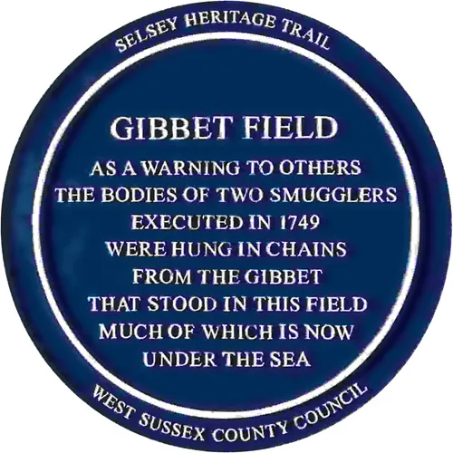 Blue plaque commemorating the hanging of two smugglers in Gibbet Field Selsey in 1749