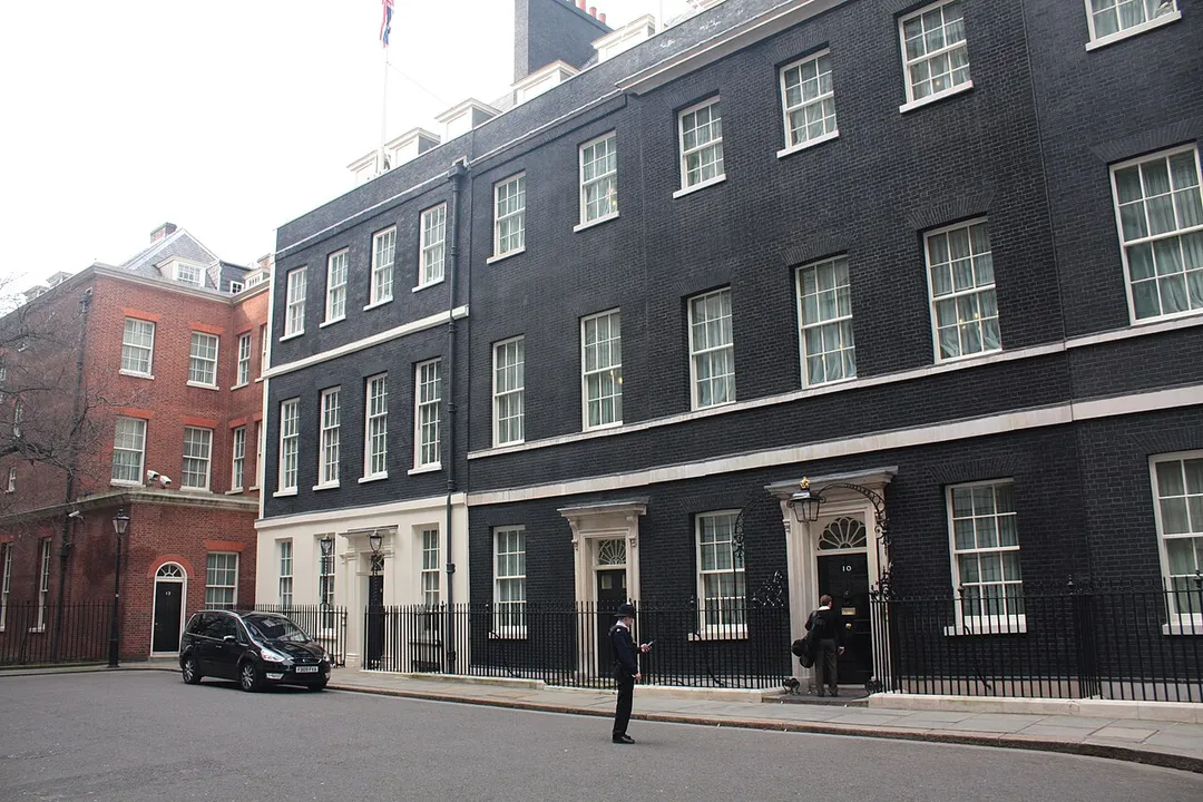 10 Downing Street, (grey brick). Also: 11 Downing (white brick); 12 Downing (red brick)