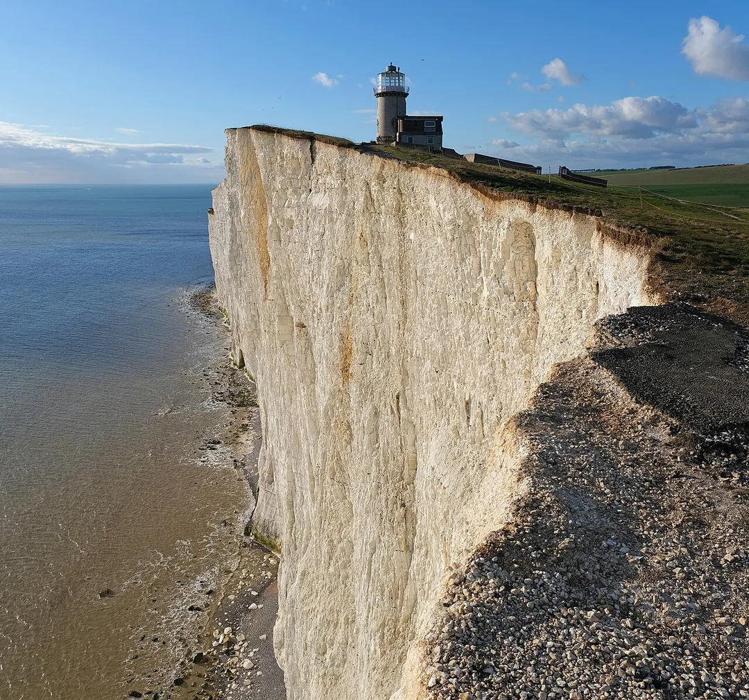 Belle Tout lighthouse and chalk cliffs by the English Channel. The lighthouse is decommissioned and located at Beachy Head, East Sussex close to the town of Eastbourne.