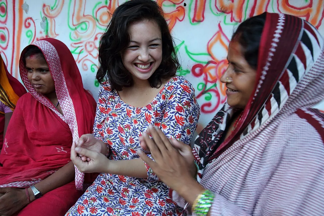 Louiza Zhang (AYAD) from NEWAH Research and Documentation Support Office talks with a group of women in Ganespur Community of Bastipur NEWAH WASH project Siraha, Udayapur District, Nepal. Photo by Jim Holmes for AusAID. (13/2529)