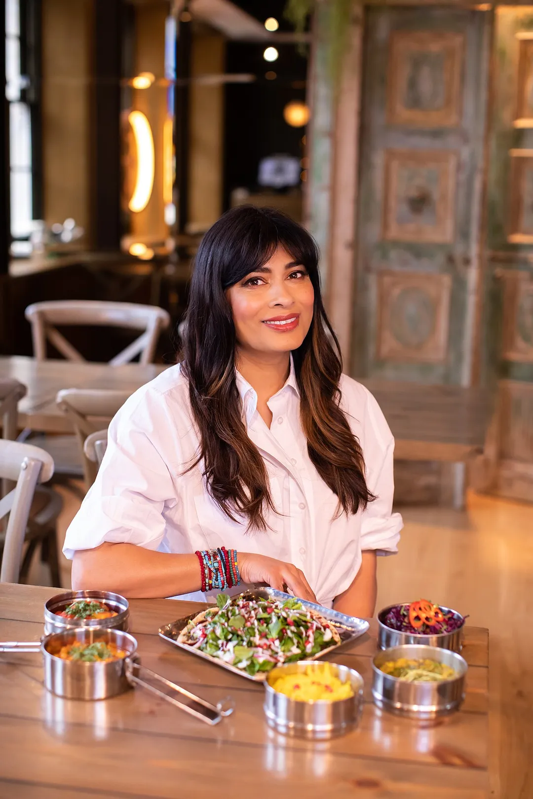 Nisha Katona with a selection of Mowgli Street Food Street Chat and Curries