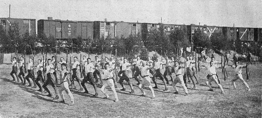 Original caption: Czechoslovak Legionaries in on the Trans-Siberian Railway, performing Sokol exercises under cover of their "těplušky" (railway trucks)