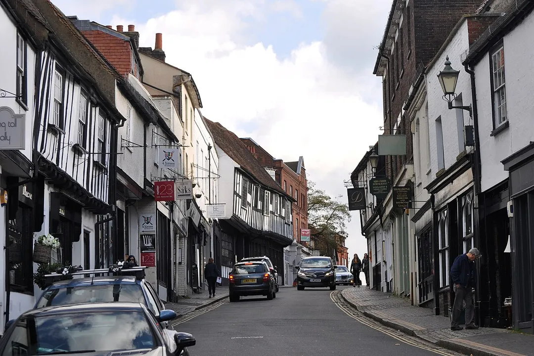 George Street, St Albans.  The overhanging Tudor Tavern (left of centre) is one of many listed buildings.


.mw-parser-output .messagebox{margin:4px 0;width:auto;border-collapse:collapse;border:2px solid var(--border-color-progressive,#6485d1);background-color:var(--background-color-neutral-subtle,#fbfcff);color:var(--color-base,#202122);box-sizing:border-box;border-inline-start-width:8px}.mw-parser-output .messagebox.mbox-small{font-size:88%;line-height:1.25em}.mw-parser-output .mbox-warning,.mw-parser-output .mbox-speedy{border:2px solid var(--border-color-error,#b22222);background:var(--background-color-error-subtle,#ffdbdb);border-inline-start-width:8px}.mw-parser-output .mbox-serious,.mw-parser-output .mbox-delete,.mw-parser-output .mbox-stop{border:2px solid var(--border-color-error,#b22222);border-inline-start-width:8px}.mw-parser-output .mbox-issue,.mw-parser-output .mbox-content{border:2px solid #f28500;background:var(--background-color-warning-subtle,#ffe);border-inline-start-width:8px}.mw-parser-output .mbox-query,.mw-parser-output .mbox-style{border:2px solid #f4c430;background:var(--background-color-warning-subtle,#ffe);border-inline-start-width:8px}.mw-parser-output .mbox-shit{border:2px solid #960;border-inline-start-width:8px}.mw-parser-output .mbox-license{border:2px solid #88a;border-inline-start-width:initial}.mw-parser-output .mbox-legal{border:2px solid var(--border-color-notice,#666);background:var(--background-color-base,#fff);border-inline-start-width:8px}.mw-parser-output .mbox-honor{border:2px solid #ca3;background:var(--background-color-warning-subtle,#fcf4db);border-inline-start-width:8px}.mw-parser-output .mbox-growth{border:2px solid #8d4;background:var(--background-color-success-subtle,#d5fdf4);border-inline-start-width:8px}.mw-parser-output .mbox-move{border:2px solid #93c;border-inline-start-width:8px}.mw-parser-output .mbox-protection,.mw-parser-output .mbox-message{border:2px solid var(--border-color-base,#aaa);border-inline-start-width:8px}.mw-parser-output .messagebox .mbox-text{border:none;padding:0.25em 0.9em;width:100%}.mw-parser-output .messagebox .mbox-image{border:none;padding-top:2px;padding-bottom:2px;padding-inline-start:0.9em;padding-inline-end:0;text-align:center}.mw-parser-output .messagebox .mbox-imageright{border:none;padding-top:2px;padding-bottom:2px;padding-inline-start:0;padding-inline-end:0.9em;text-align:center}.mw-parser-output .messagebox .mbox-empty-cell{border:none;padding:0;width:1px}.mw-parser-output .messagebox .mbox-invalid-type{text-align:center}@media(min-width:720px){.mw-parser-output .messagebox{margin:4px 10%}.mw-parser-output .messagebox.mbox-small{clear:right;float:right;margin:4px 0 4px 1em;width:238px}}body.skin--responsive .mw-parser-output table.messagebox img{max-width:none!important}Wikidata has entry The Tudor Tavern (Q17555437) with data related to this item.