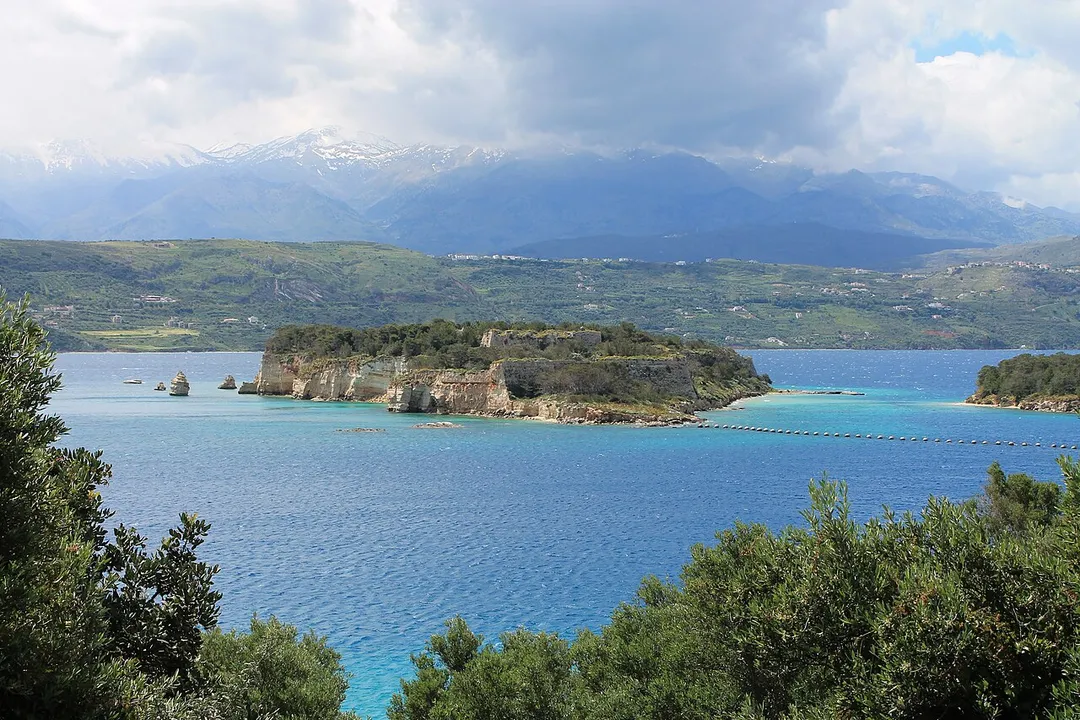Souda is the name of the small island that stands like a guard in the entrance of the gulf of Souda (Crete) with the old Venetian fortress.