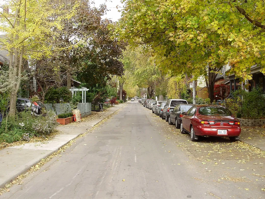 Looking north up De Grassi Street, a residential one-way street, north of Queen Street East in Toronto, Ontario, Canada.