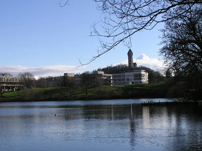 Stirling (Scotland) - Buildings at University of Stirling, the Airthrey Loch and the Wallace Monument. view from the west side of Airthrey Loch, facing roughly south.