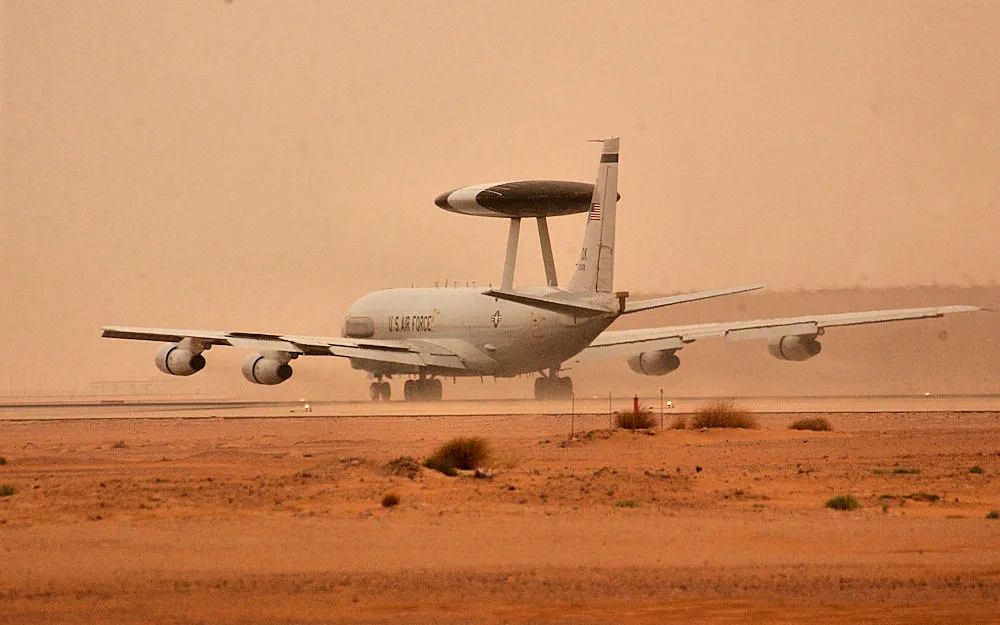 An E-3 AWACS aircraft deployed to the 363rd Air Expeditionary Wing takes off for a mission during a sand storm March 25. Aircraft move around the clock to support Operation Iraqi Freedom at forward deployed locations in Southwest Asia. Operation Iraqi Freedom is the multi-national coalition effort to liberate the Iraqi people, eliminate Iraq's weapons of mass destruction and the regime of Saddam Hussein.