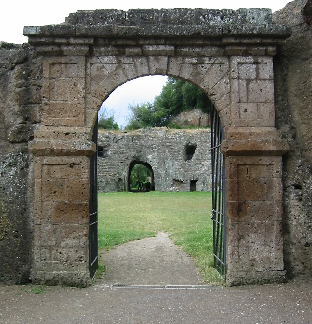The ancient roman amphitheatre of Sutri in Lazio, Italy.  Sign in front of the anfiteatro: