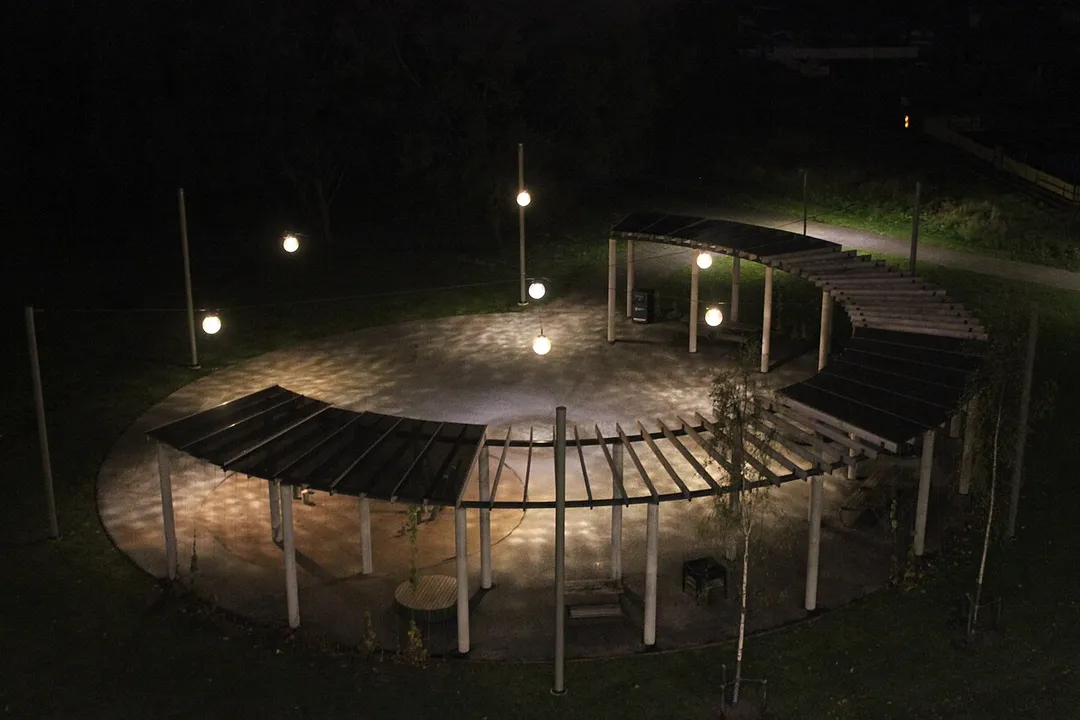 The communal space near the playground from a top view during night