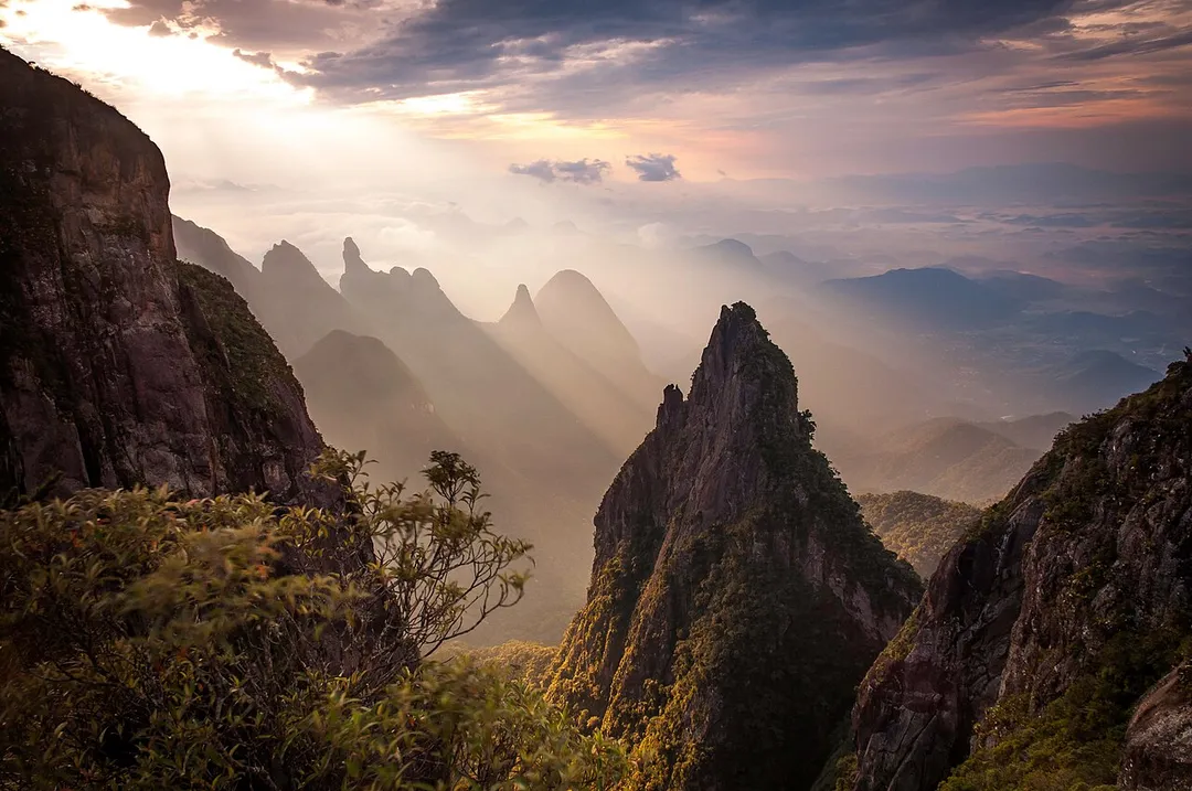 Rocks formations and the Dedo de Deus (God's Finger) peak in the background, at the Serra dos Órgãos National Park, Rio de Janeiro state, Brazil.