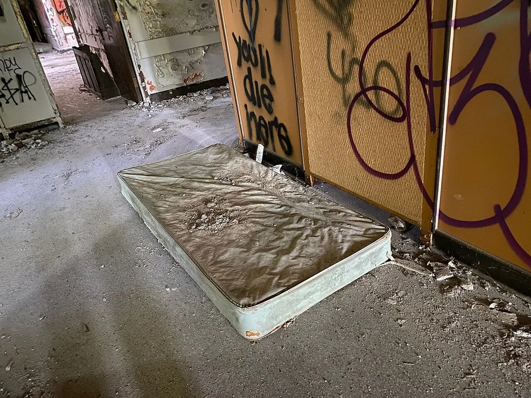 Interior of a girls' dormitory at Letchworth Village, a residential facility for disabled children and adults that operated in Thiells, New York from 1911 through 1996. Many patients were abused, neglected, and used for medical experimentation at the facility. This photo was taken on August 13, 2021.