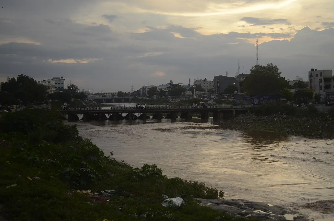 Noyyal River in Tiruppur_water flowing after heavy rain. Bank full of plastic garbage