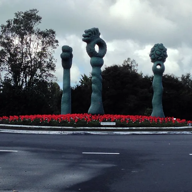 Roundabout on the intersection of Titirangi Road, Scenic Drive, Huia Road, Atkinson Road, and Kohu Road. Auckland, New Zealand