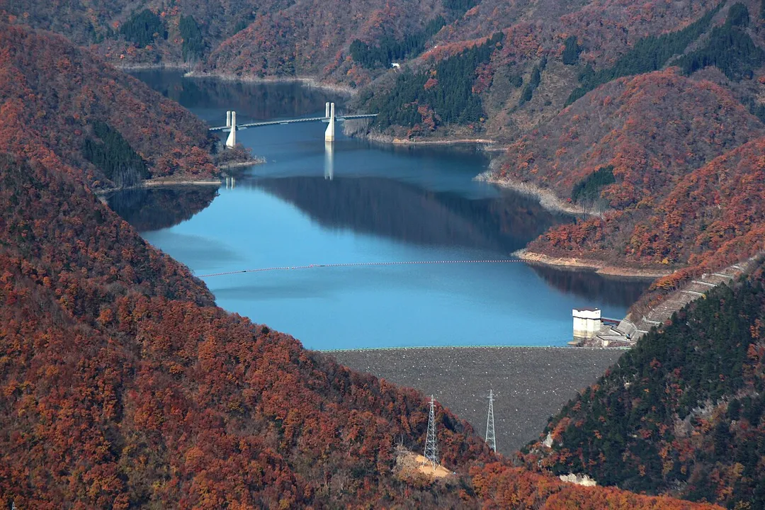 Tokuyama Dam and Tokunoyamahattoku Bridge seen from Mount Hanabusa in Ibigawa, Gifu prefecture, Japan.