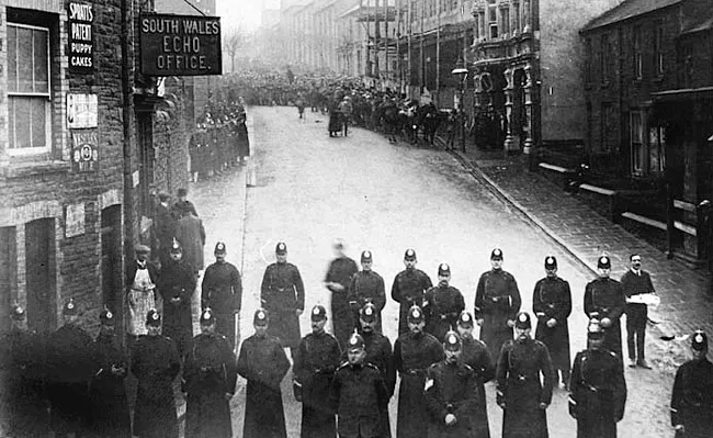 Police officers blocking a street during the Tonypandy Riots of 1910-1911