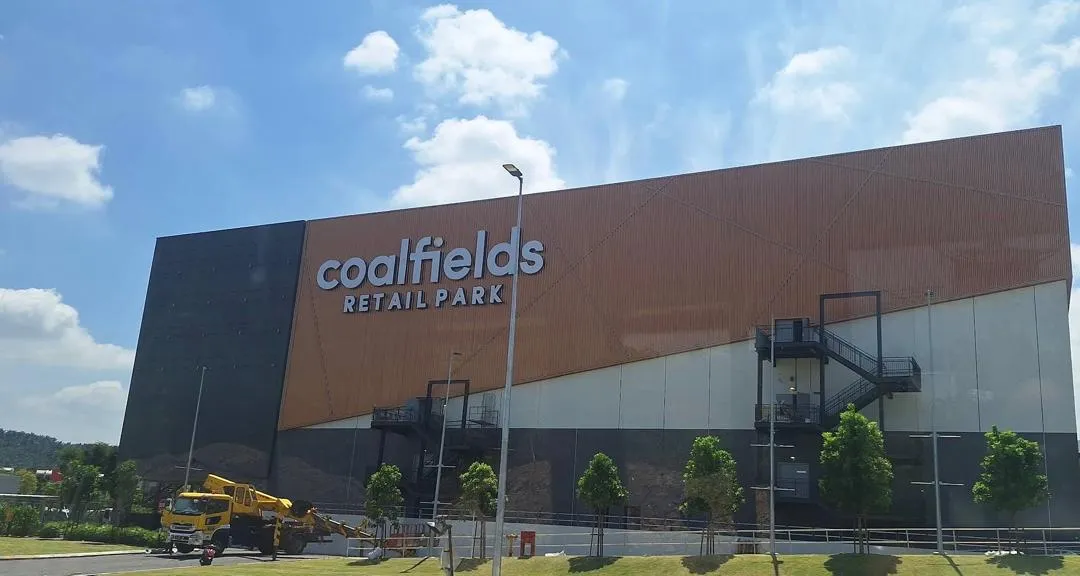 Facade of Coalfields Retail Park taken from the main road of Jalan Kuala Selangor-Kepong on a passing bus.