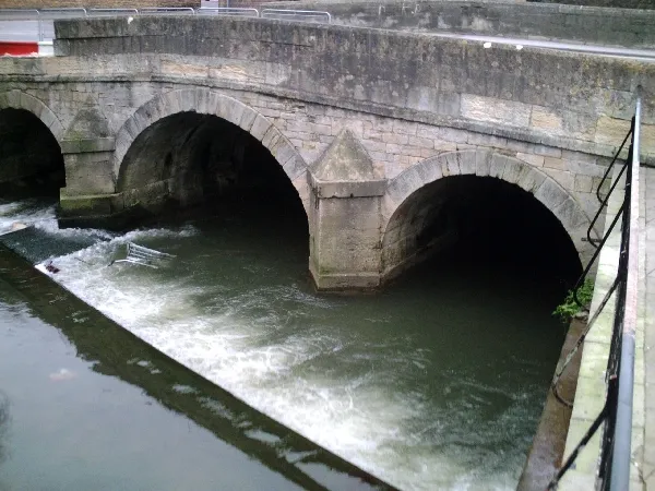 The River Biss flowing under the old town bridge in Trowbridge, Wiltshire, UK