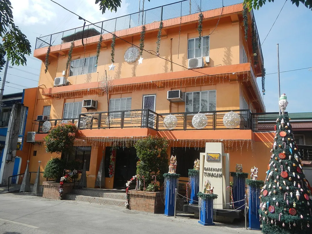 Barangay Center of Tunasan, Muntinlupa City E. Rodriguez Street corner National Road (Tunasan, Muntinlupa City) Tunasan Tunasan 14°22'1"N   121°1'58"E (Note: Judge Florentino Floro, the owner, to repeat, Donor Florentino Floro of all these photos hereby donate gratuitously, freely and unconditionally all these photos to and for Wikimedia Commons, exclusively, for public use of the public domain, and again without any condition whatsoever).