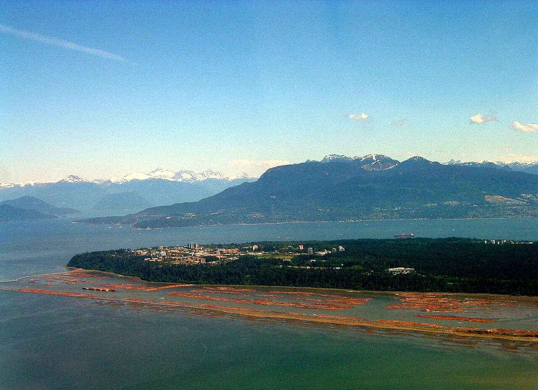 An aerial view of the campus of the University of British Columbia in Vancouver, British Columbia, Canada. Includes Pacific Spirit Park as well. Taken from an airplane taking off from Vancouver International Airport.