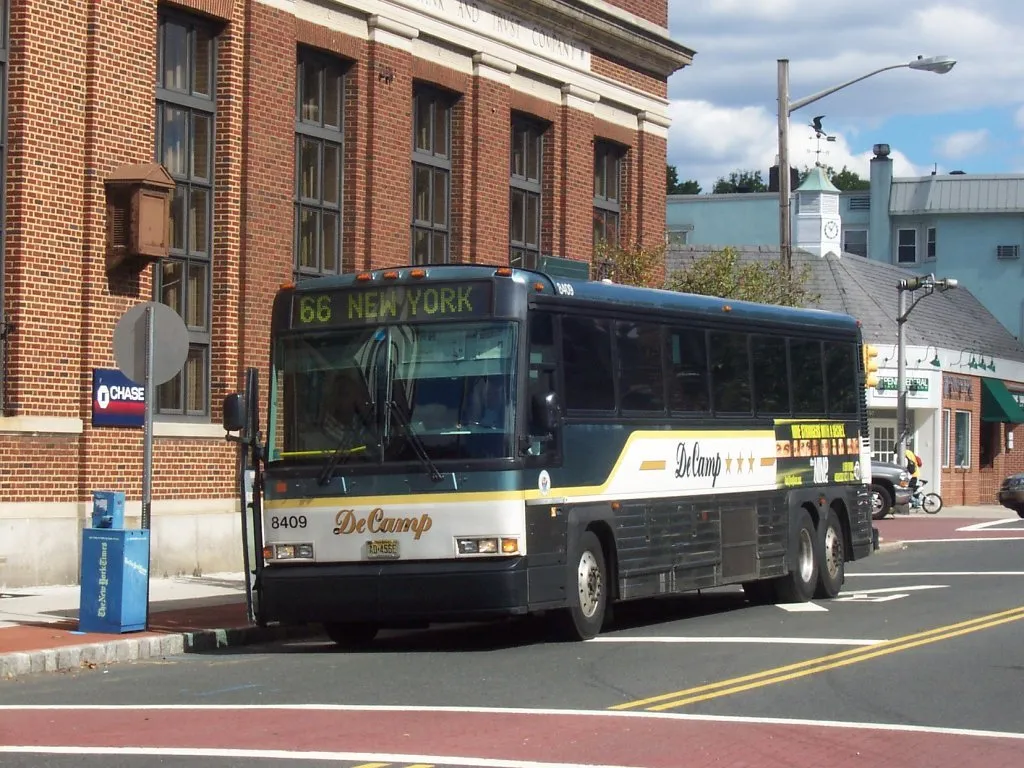 DeCamp Bus Lines MCI D4000 8409 (owned by New Jersey Transit) at the Upper Montclair Railroad Station (Bellevue Plaza) on the DeCamp 66 line.
