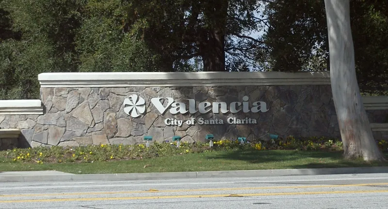 A sign welcoming visitors to Valencia.  This sign was located on McBean Parkway at the interchange with the Golden State Freeway (Interstate 5), near the California Institute of the Arts. In spring 2017, this sign was replaced with a generic "City of Santa Clarita" welcome sign which no longer mentions Valencia.