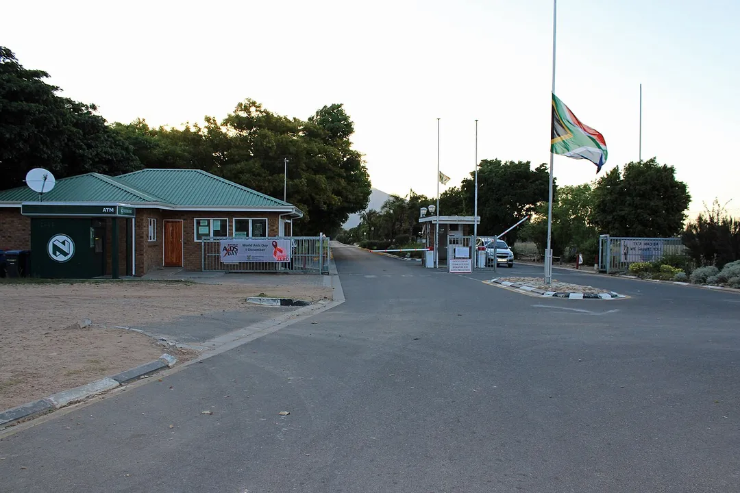 South African flag flying half-mast outside Drakenstein Correctional Centre during the national mourning period for Nelson Mandela.