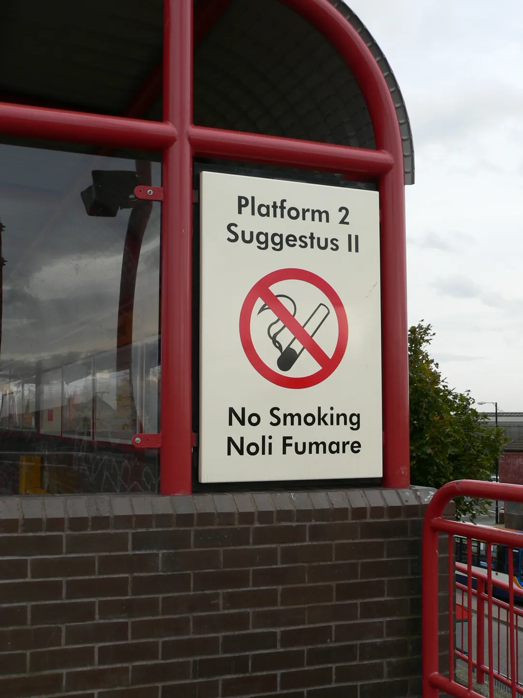 One of the bilingual English and Latin signs at Wallsend Tyne and Wear Metro station. It reads "Platform 2 / Suggestus II / No Smoking / Noli Fumare".