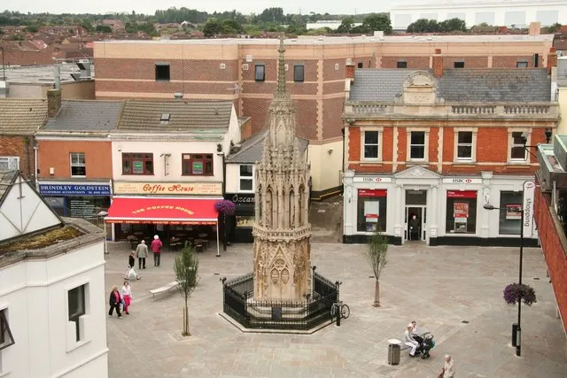 Waltham Cross One of the three remaining of the original 12 Eleanor crosses erected by King Edward I to mark the overnight resting places of the funeral cortege of Queen Eleanor, following her death in Harby on November 28th 1290.
Architecturally, it follows the same design as the cross at Northampton and the lost crosses of Cheapside and Charing in London, though more Decorated in style. Hexagonal in plan, it rises through diminishing stages of blind tracery with heraldic motifs, through a second tier of six elaborate pinnacled canopies. These house three statues of Eleanor in traditional pose by master mason Alexander of Abingdon, to a third hexagonal tier of blind tracery surmounted by a cross. 

Waltham Cross has somehow miraculously survived more than 700 years of adversity including Civil War, encroachment by adjacent buildings, road schemes for turnpikes, the misguided intentions of Victorian restorations and bombs dropped during the Second World War. It now stands much restored and rather ignominiously as the centrepiece of a modern pedestrian shopping area.