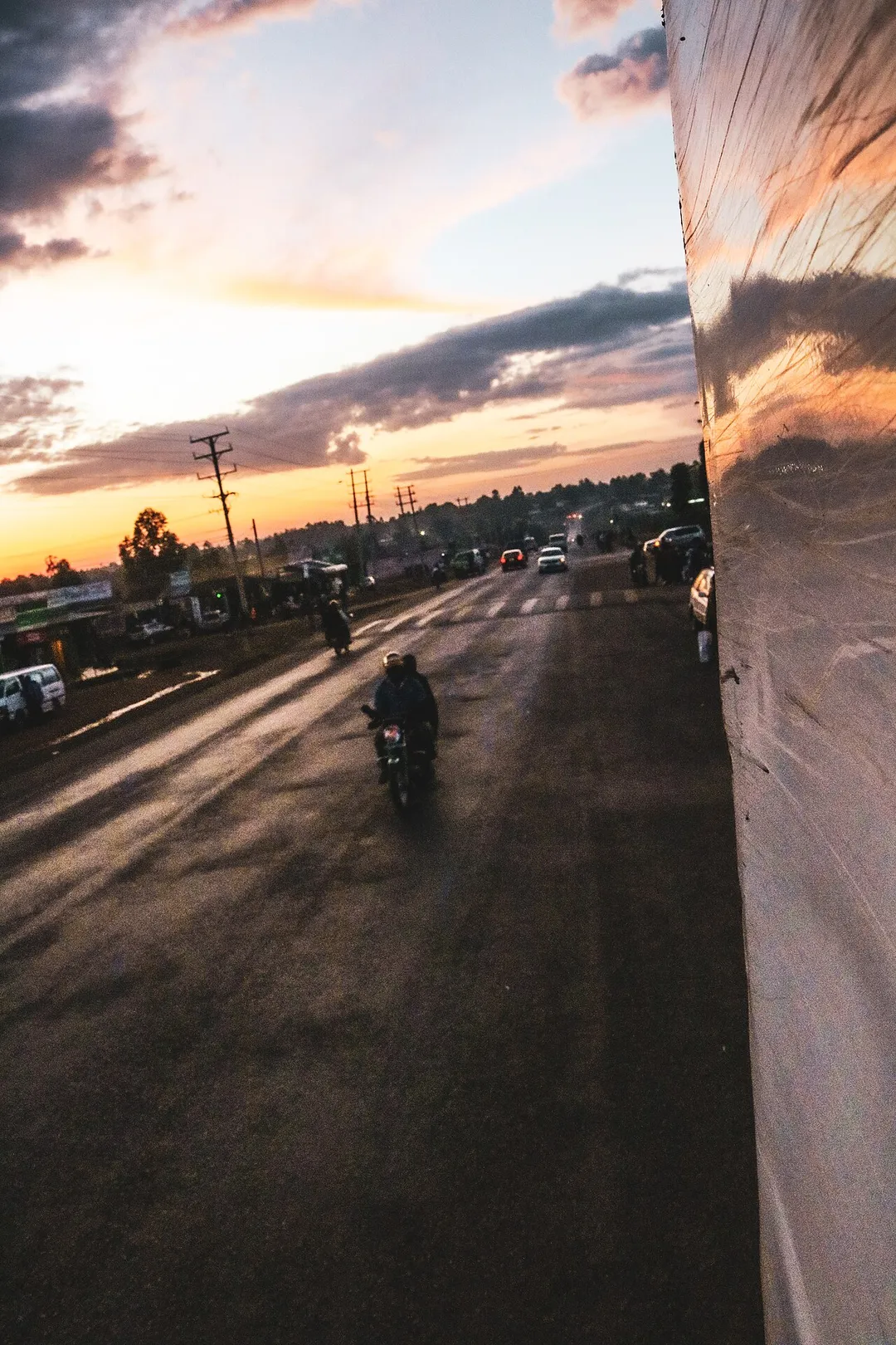 This happens to be a popular stop for most vehicles along the Eldoret-Malaba road, the town is called Webuye. This photo shows a fraction of the movement of vehicles going in and out of the small town as well as a beautiful sunset to bring out the towns' activity.