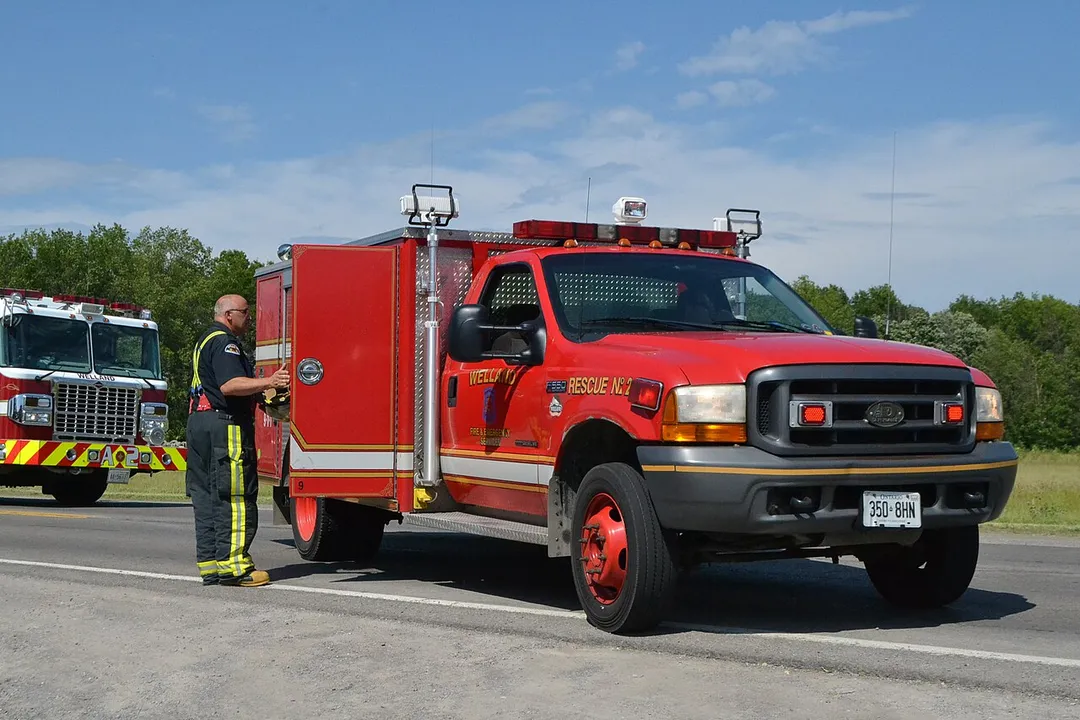 Firefighter from the Welland Fire Department replacing equipment in Rescue No 2. The unit was responding to a motor vehicle accident. Dependable Emergency Vehicles are made in Brampton, Ontario. This one is based on a Ford F550 diesel.