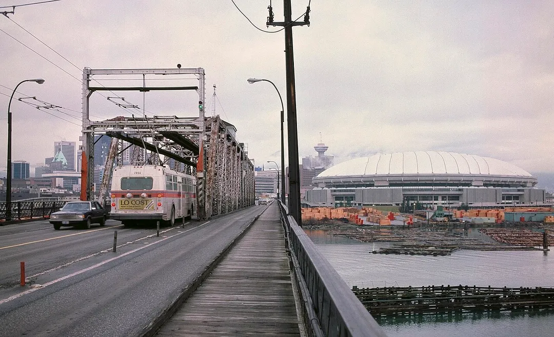 Vancouver's second Cambie Street Bridge, opened in 1911 and closed in 1984, was a swing bridge. This photo looking north on the bridge shows the then-new BC Place Stadium, about six months after it opened. The bridge closed in November 1984, to be replaced by a new bridge at approximately the same location. This 1911 bridge was formally named the Connaught Bridge (starting in 1912), but was commonly referred to as the Cambie Street Bridge.