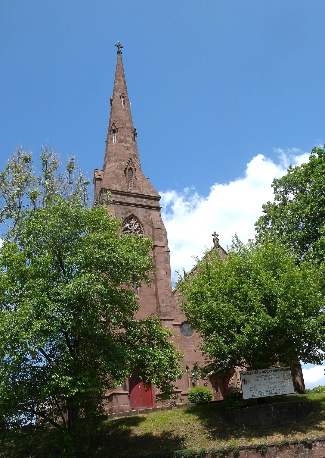 Looking north at Evangelical Methodist Church in West Orange, New Jersey on a mostly sunny midday.