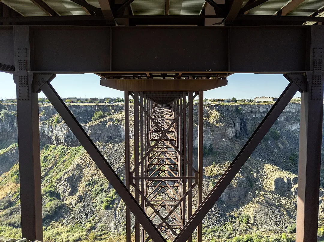 The I. B. Perrine Bridge is four-lane truss arch span in the western United States. Located at Twin Falls, Idaho, it carries U.S. Highway 93 over the Snake River Canyon, connecting to Jerome County and Interstate 84. 
The Perrine Bridge is approximately 1,500 feet (457 m) in total length, with a main span of 993 feet (303 m) and a deck height of 486 feet (148 m) above the Snake River it is the eighth highest bridge in the United States. The elevation above sea level for the bridge deck is approximately 3,600 feet (1,100 m). 
The bridge is named for I. B. Perrine (1861–1943), who spearheaded the early 20th century irrigation projects in the Magic Valley region and is largely credited as the main founder of Twin Falls; a statue of Perrine is at the visitors' center at the south end of the bridge. 
Originally named the Twin Falls-Jerome Intercounty Bridge, a steel cantilever bridge was opened to traffic 92 years ago in September 1927, and formally dedicated by governor H. C. Baldridge on October 1, 1927. The privately financed $750,000 structure was originally a toll bridge; the tolls were eliminated in April 1940 after the bridge was purchased by the state of Idaho for $482,000. 

By the early 1970s, the original bridge was outdated and unable to handle heavy loads and required replacement. Construction of the current bridge began in May 1973 and was completed in July 1976 at a cost of $10.56 million. The new bridge was dedicated on July 31, 1976; the original cantilever bridge to the west was later disassembled.