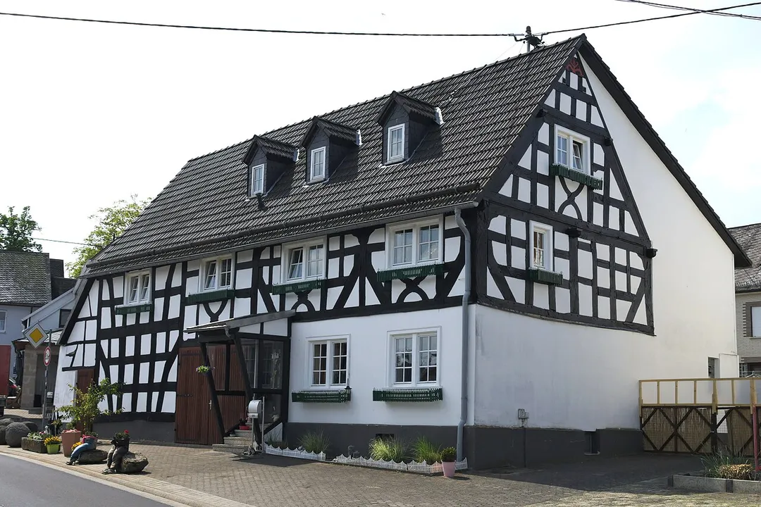 Cultural heritage monument at Wiesenweg 6, Westerburg-Sainscheid, Westerwaldkreis, Germany. Half-timbered house from the first half of 18th century.